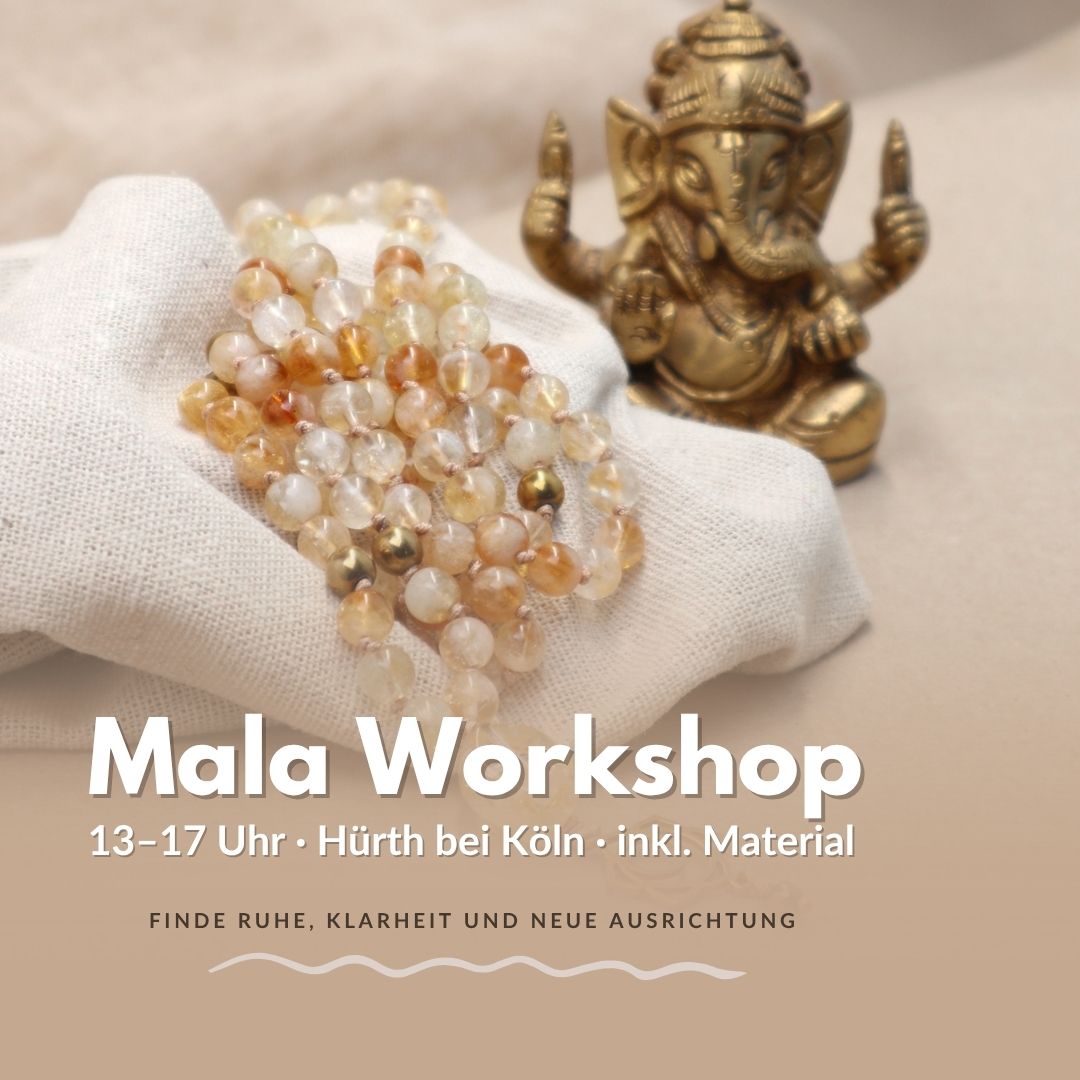 Handgemachte Mala Kette liegt auf einem Leinentuch beim Mala Workshop